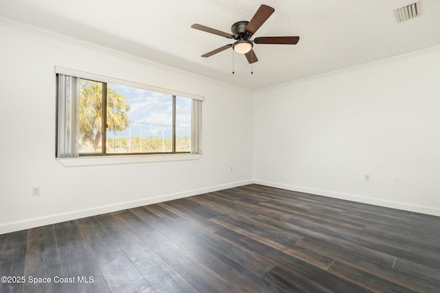 unfurnished room with visible vents, baseboards, ceiling fan, dark wood finished floors, and ornamental molding