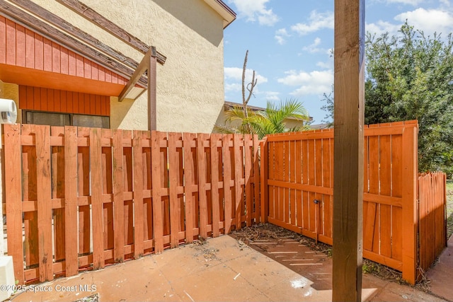 view of patio featuring fence
