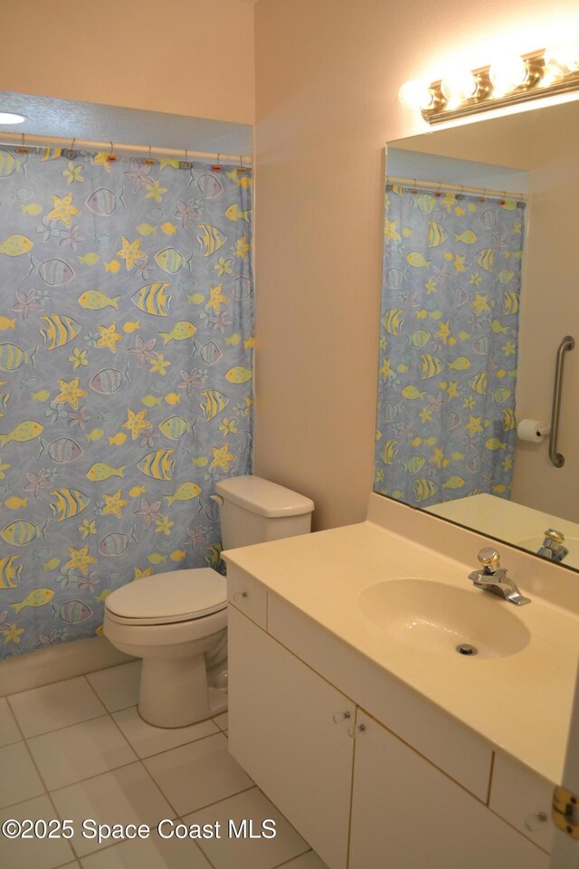 full bath with tile patterned floors, toilet, and vanity