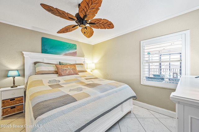 bedroom featuring baseboards, ceiling fan, and crown molding