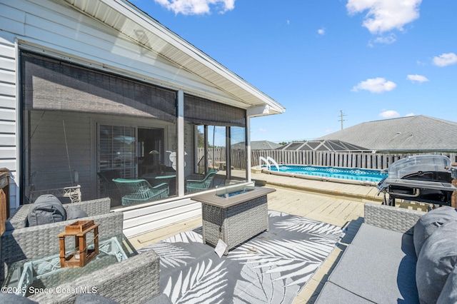 view of patio / terrace with a fenced backyard, an outdoor hangout area, a fenced in pool, and area for grilling