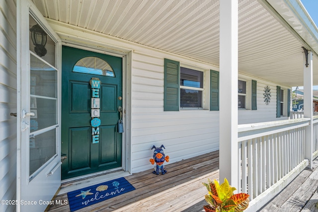 doorway to property featuring covered porch