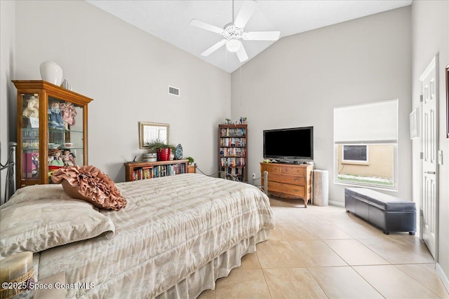 bedroom featuring visible vents, high vaulted ceiling, light tile patterned flooring, and a ceiling fan