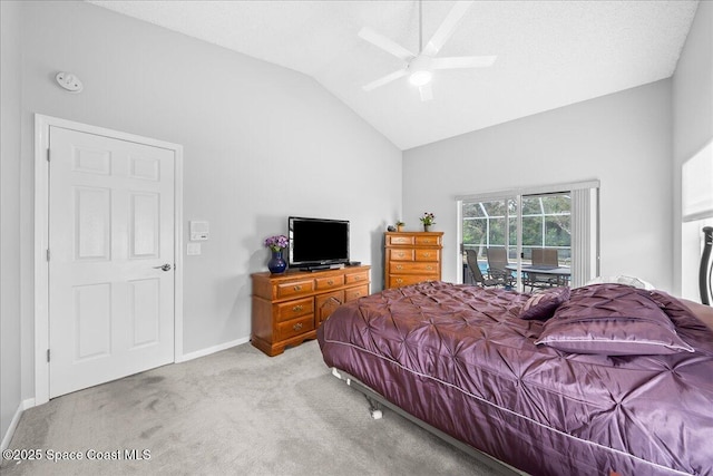 carpeted bedroom with access to outside, a ceiling fan, baseboards, and vaulted ceiling