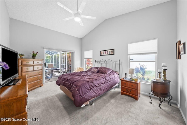 carpeted bedroom featuring lofted ceiling, a ceiling fan, access to outside, a textured ceiling, and baseboards