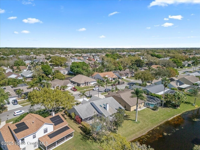 birds eye view of property with a residential view and a water view