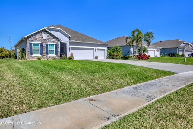 ranch-style house featuring an attached garage, stone siding, driveway, and a front lawn