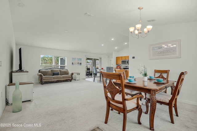 dining area featuring a chandelier, recessed lighting, light carpet, visible vents, and vaulted ceiling