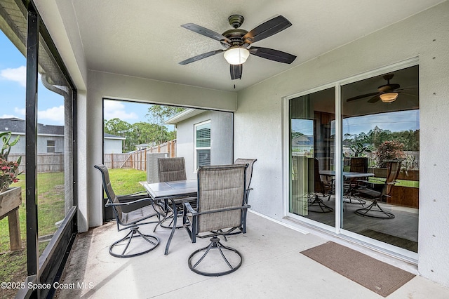 sunroom with a ceiling fan