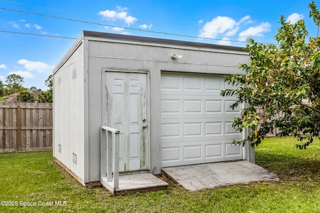 garage featuring fence