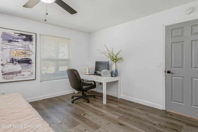 office space featuring ceiling fan, baseboards, and wood finished floors