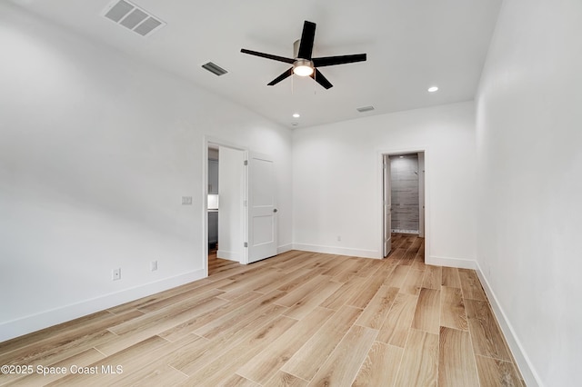 unfurnished room featuring light wood finished floors, baseboards, visible vents, and recessed lighting