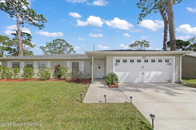 single story home featuring a garage, driveway, and a front lawn