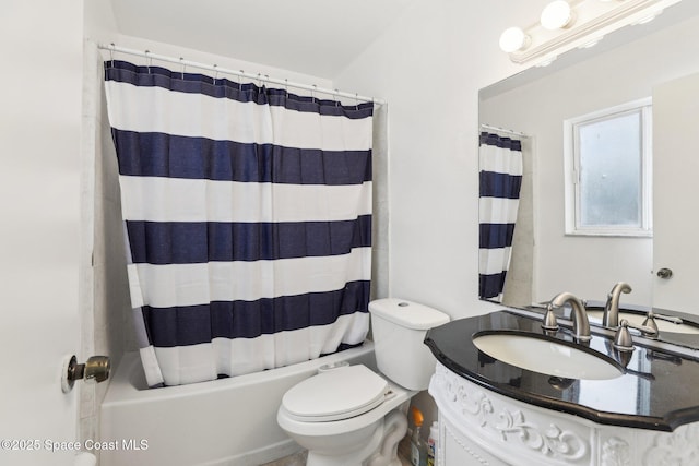 bathroom featuring shower / bathtub combination with curtain, toilet, and vanity