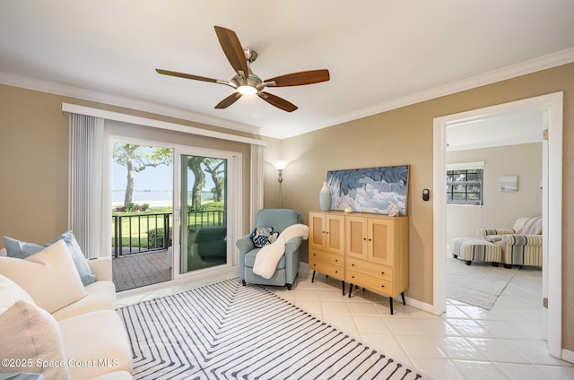 sitting room with a ceiling fan, a wealth of natural light, and ornamental molding
