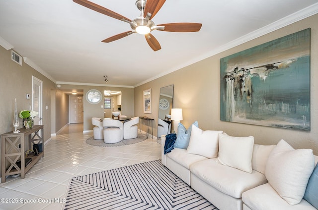 living room featuring crown molding, light tile patterned flooring, visible vents, and ceiling fan
