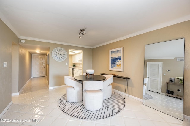 dining space with light tile patterned floors, baseboards, and crown molding