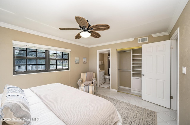 bedroom with visible vents, connected bathroom, crown molding, ceiling fan, and light tile patterned floors