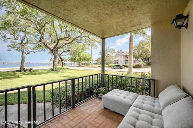 balcony with a residential view and covered porch