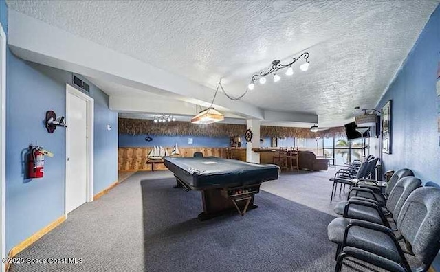 recreation room featuring carpet flooring, pool table, and a textured ceiling