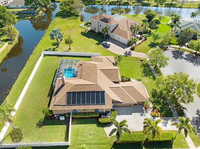 bird's eye view featuring a water view and a residential view