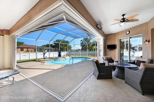 view of pool with a fenced in pool, ceiling fan, a lanai, a fenced backyard, and a patio