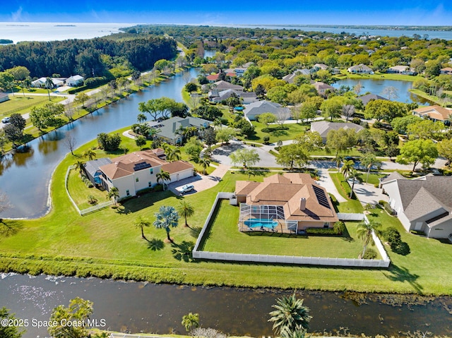 aerial view with a residential view and a water view