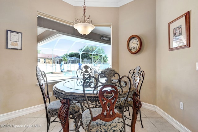 dining area with light tile patterned floors, baseboards, and a sunroom