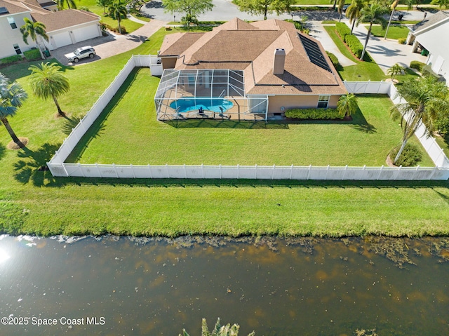 birds eye view of property with a water view