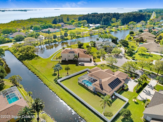 birds eye view of property with a residential view and a water view