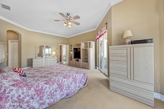 bedroom featuring baseboards, visible vents, arched walkways, ornamental molding, and carpet flooring