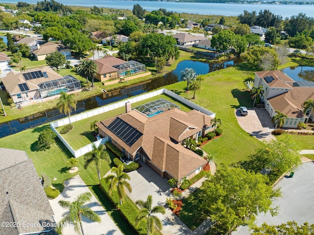 birds eye view of property featuring a residential view and a water view