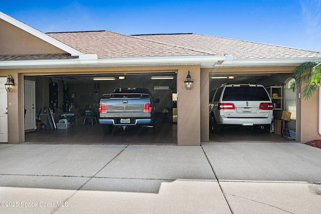 garage with concrete driveway