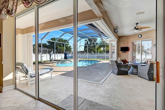 view of pool with a fenced in pool and a ceiling fan