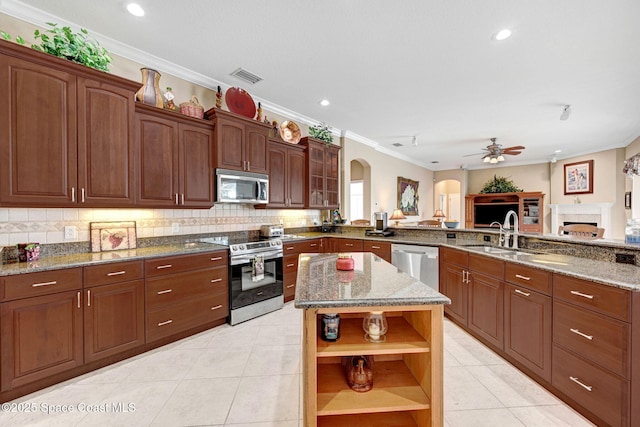 kitchen featuring visible vents, ceiling fan, light tile patterned floors, stainless steel appliances, and open shelves