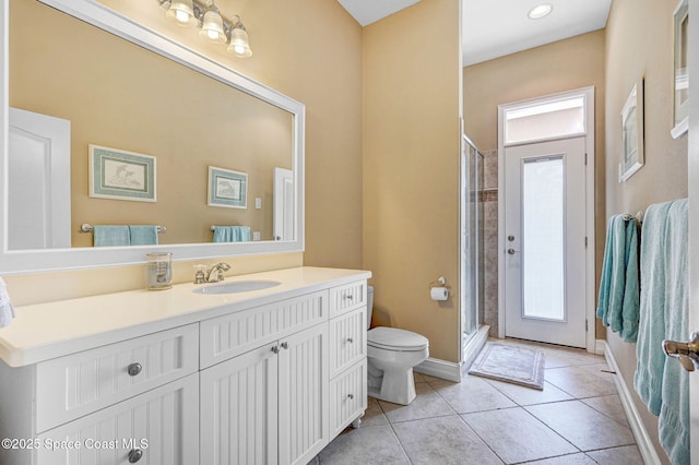 full bathroom with tile patterned flooring, a stall shower, toilet, and vanity