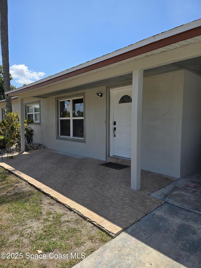 2013 Rollins Dr, Cocoa, FL 32922 - entrance to property with stucco siding