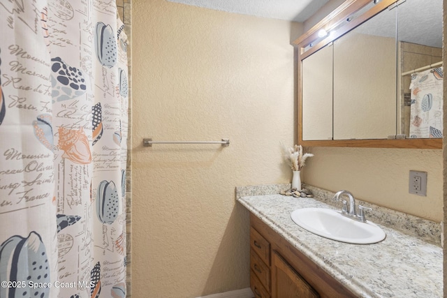 2013 Rollins Dr, Cocoa, FL 32922 - bathroom with a textured wall, vanity, and a shower with shower curtain