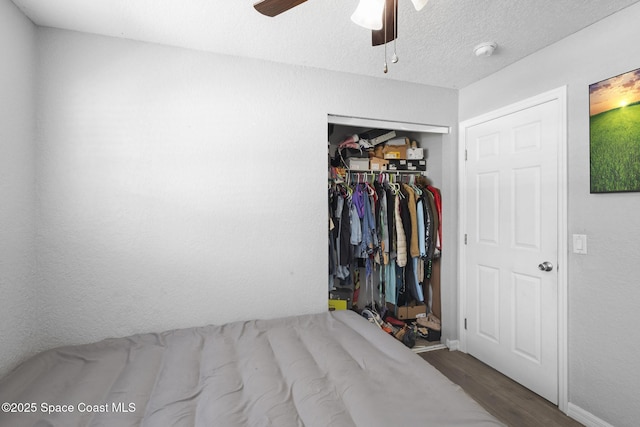 2013 Rollins Dr, Cocoa, FL 32922 - bedroom featuring wood finished floors, a closet, ceiling fan, and baseboards