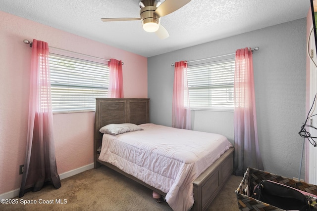 2013 Rollins Dr, Cocoa, FL 32922 - bedroom featuring multiple windows, carpet, a textured ceiling, a ceiling fan, and a textured wall
