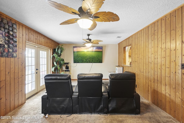 2013 Rollins Dr, Cocoa, FL 32922 - carpeted home theater with wooden walls, french doors, and a textured ceiling