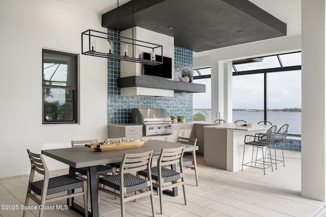 dining area featuring a water view