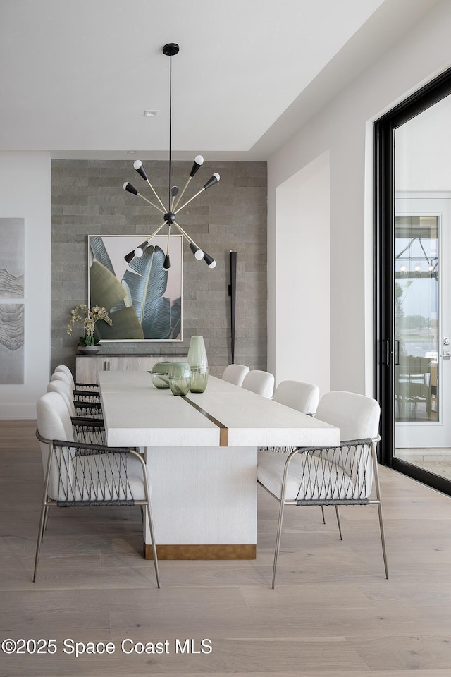 dining space with wood finished floors