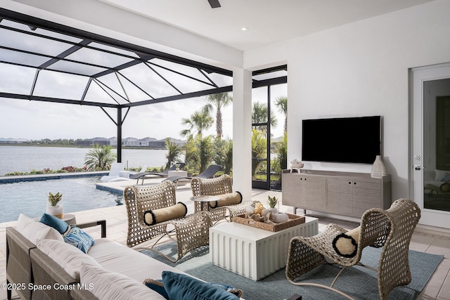 view of patio / terrace with outdoor lounge area, a water view, a lanai, and an outdoor pool