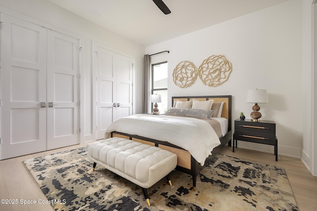 bedroom featuring light wood-style floors, ceiling fan, and baseboards