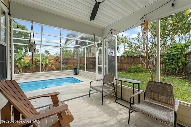 view of pool featuring a lanai, a fenced backyard, and a patio