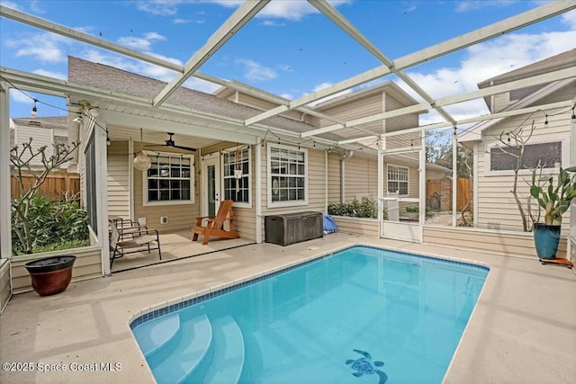 view of pool with a patio, a lanai, fence, a ceiling fan, and a fenced in pool