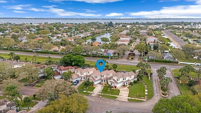 aerial view with a residential view and a water view