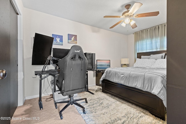 bedroom with carpet floors, ceiling fan, and baseboards