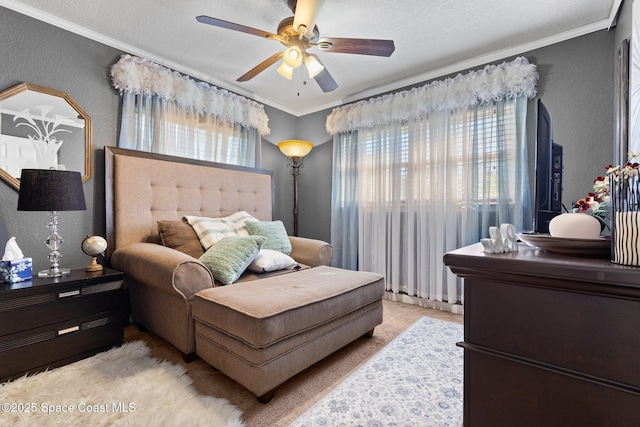 bedroom featuring crown molding, a textured wall, a textured ceiling, and a ceiling fan